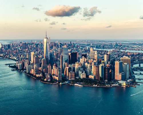 Image of the Manhattan skyline at sunset from an elevated angle.