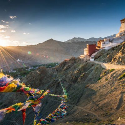 Prayer flag in Tsemo castle with beautiful mountain snow landscape background in Leh Ladakh